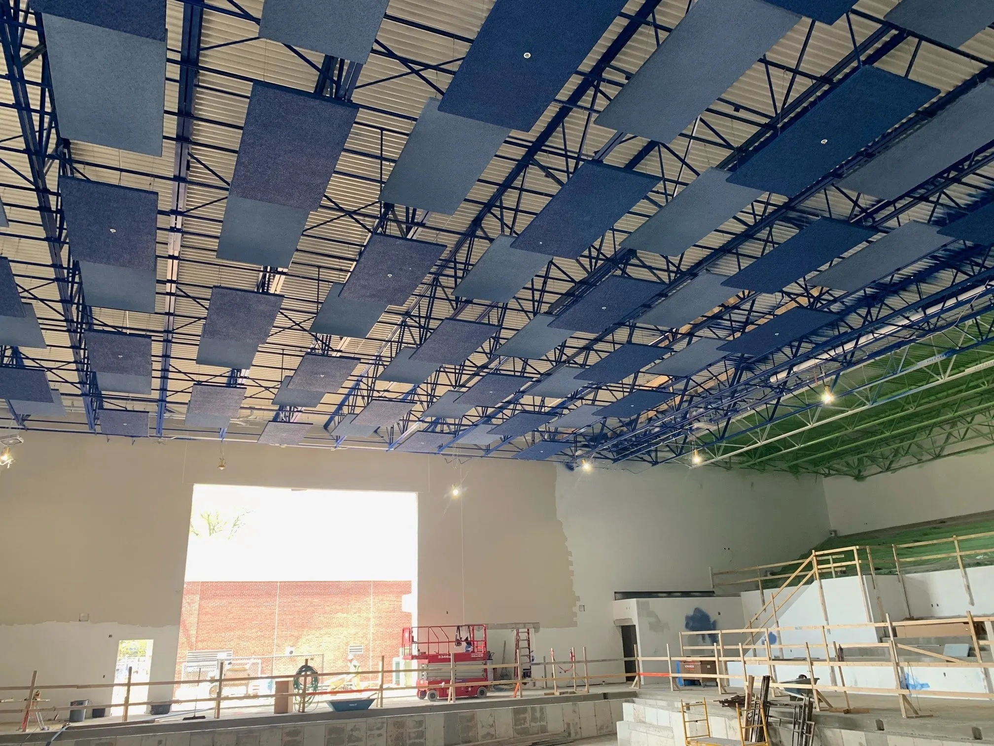 Auditorium ceiling steel and acoustic panels mid-install